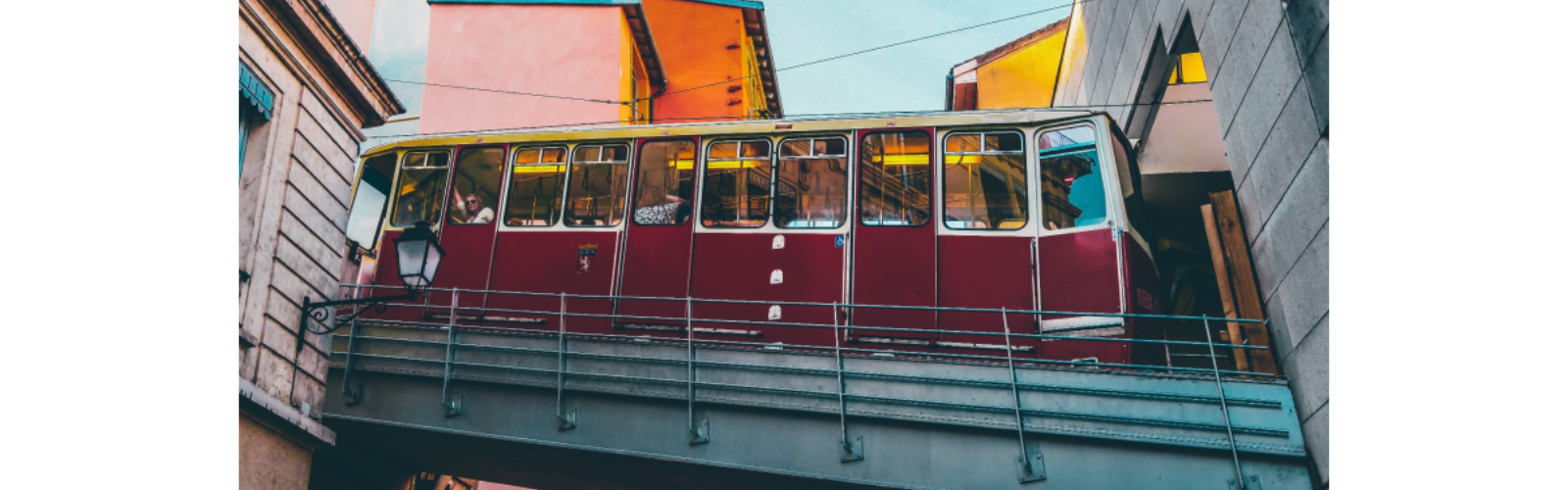 Tram car moving through Lyon. It is moving uphill.